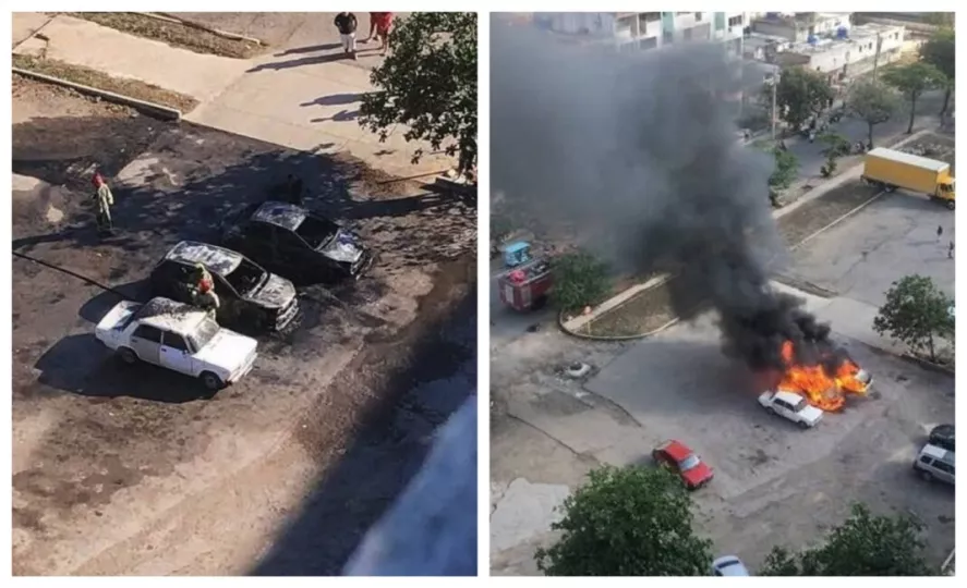 Dos automóviles en llamas en un parqueo en La Habana.
