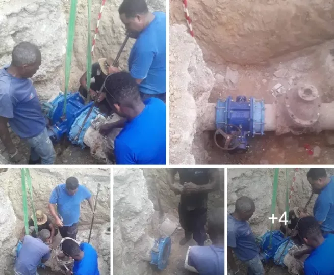 Técnicos realizando labores de mantenimiento y sustitución de una válvula en la infraestructura hidráulica de La Habana.